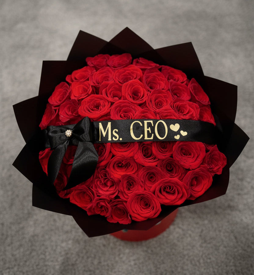 Burnaby Bouquet of red roses with a black ribbon