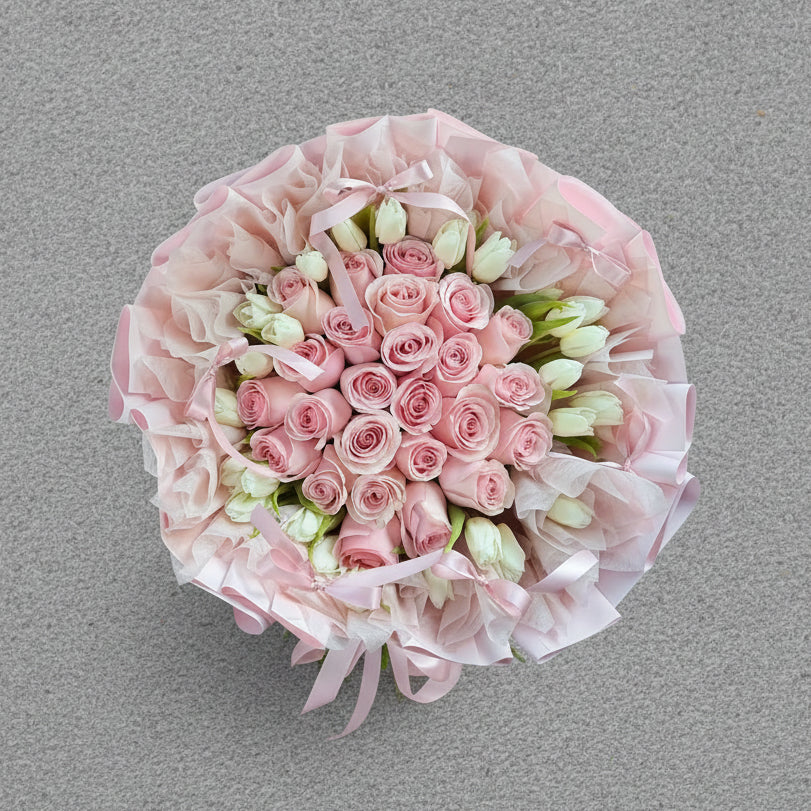 Bouquet of pink roses and white tulips