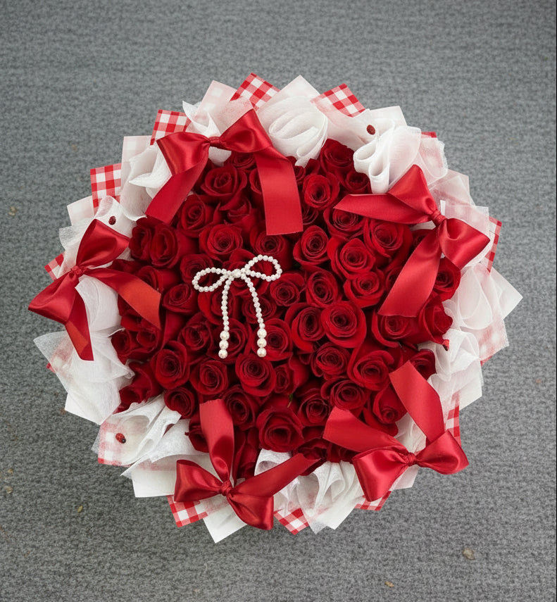 Vancouver Decorative flower arrangement with red and white ribbons 