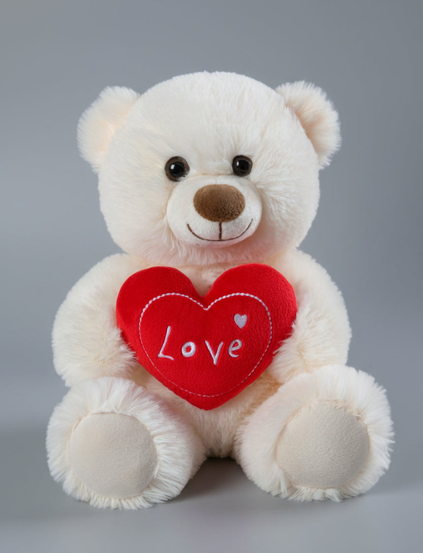 White teddy bear holding a red heart with 'Love' written on it against a white background
