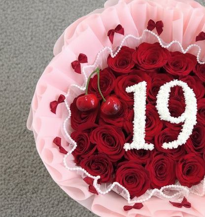 Bouquet of red roses with pink wrapped