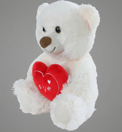 White teddy bear with a red heart that says 'love' on a white background