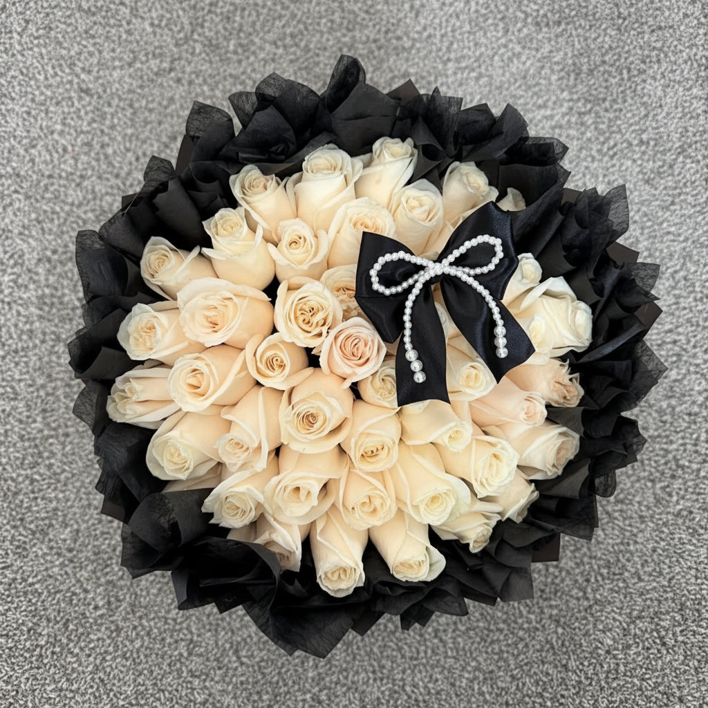 Bouquet of white roses with black wrapped and black ribbons