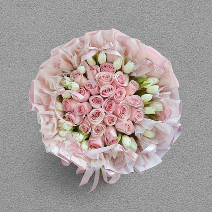 Bouquet of pink roses and white tulips