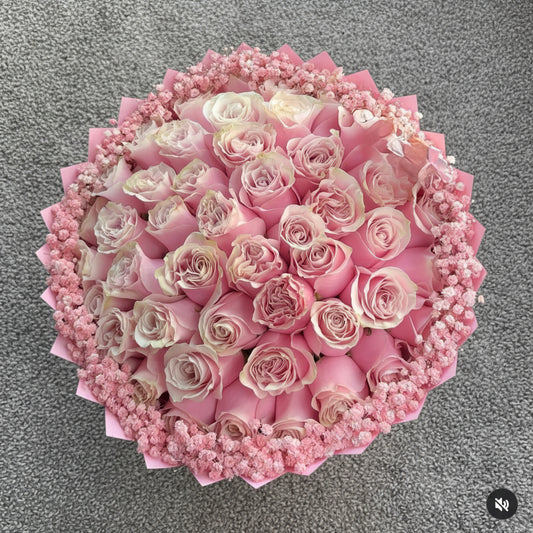 Bouquet of pink roses with pink wraps