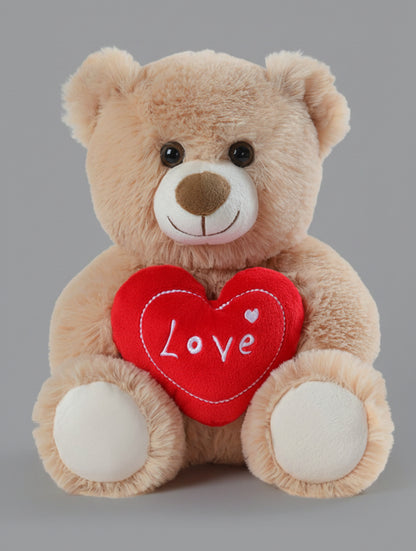 Plush teddy bear holding a red heart with 'Love' written on it against a white background