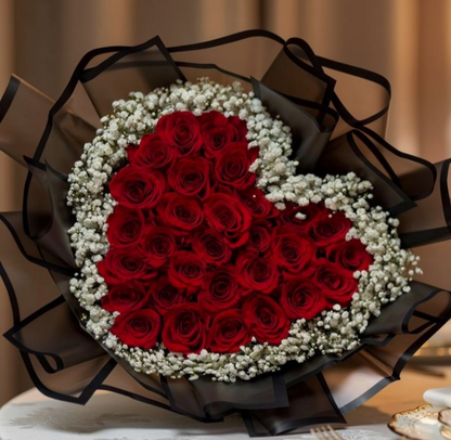 vancouver Heart-shaped bouquet of red roses and baby' breath flowers wrapped in black ribbon 